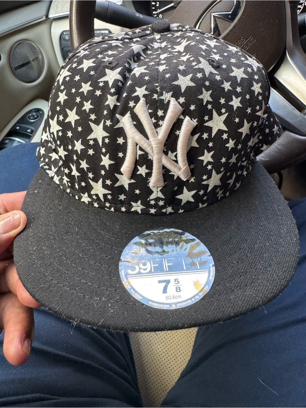 New Era Black Hat with White Star Pattern and NY Logo 7 5/8